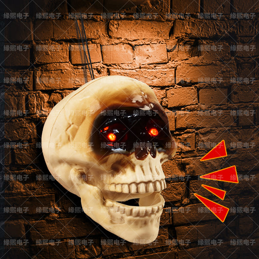 Animated skull head Halloween decoration with glowing red eyes and size measurements