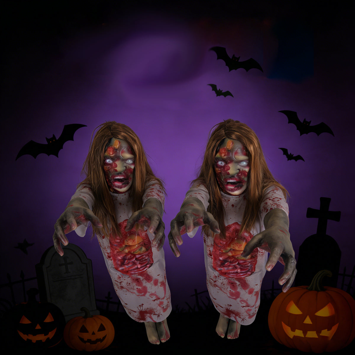 Blonde female corpse Halloween prop posed beside an RIP tombstone