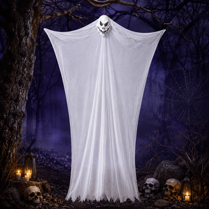 White gauze ghost hanging in a haunted forest display with skulls and candles
