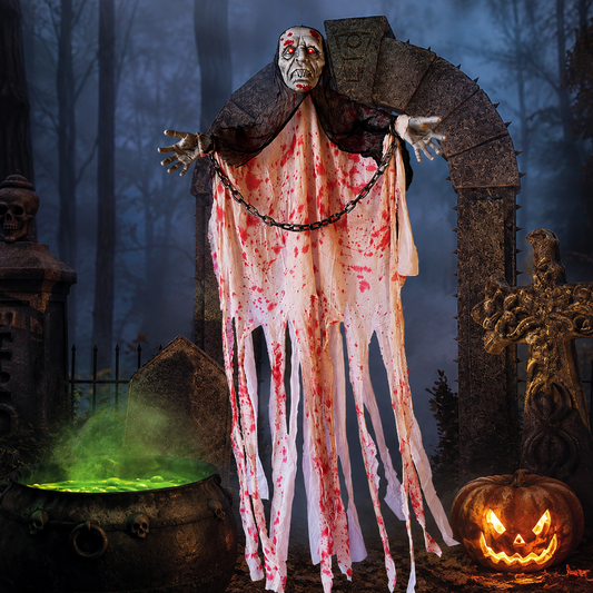 Chained hanging ghost in a blood-stained white robe displayed in a haunted graveyard