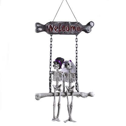 Full spooky welcome hanging skeleton sign on a white background