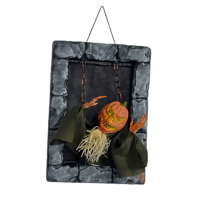 Pumpkin animated tombstone figure hanging in a gray stone frame on a white background