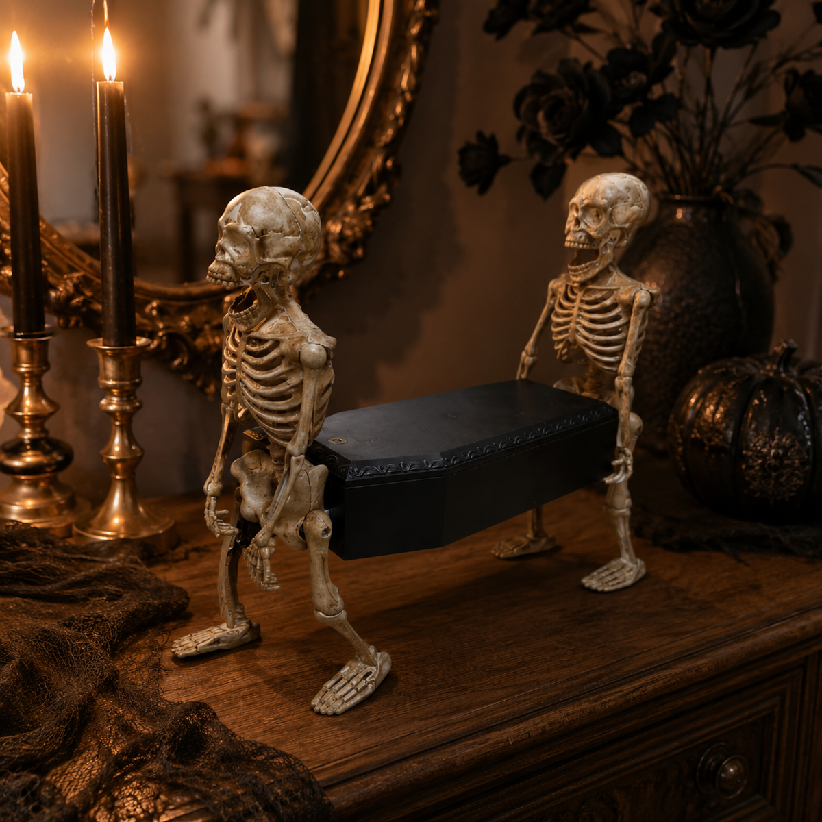 Animated skeleton coffin prop in a candlelit Halloween mantel display
